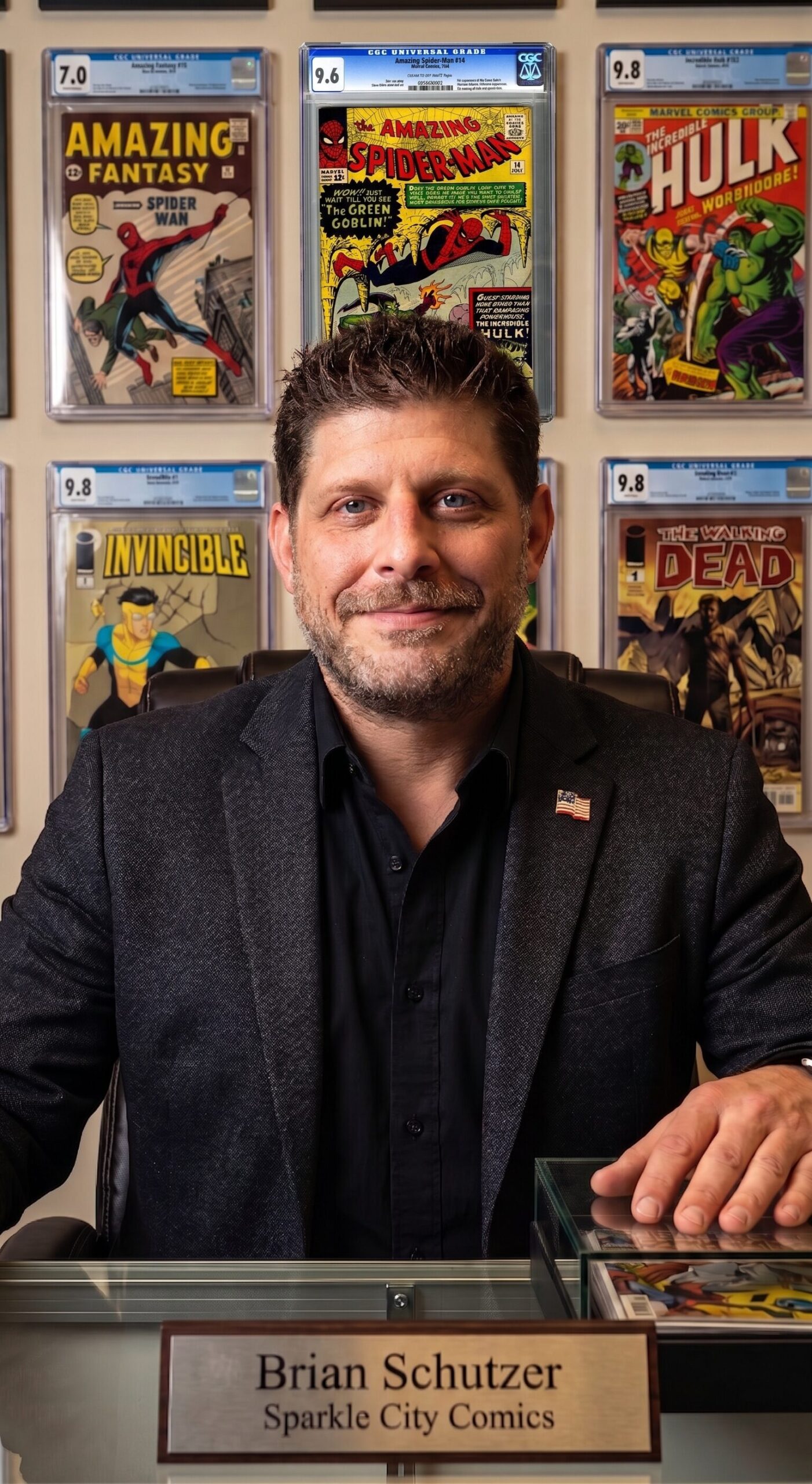 Brian Schutzer, founder of Sparkle City Comics, in his office with a wall of CGC graded key issues